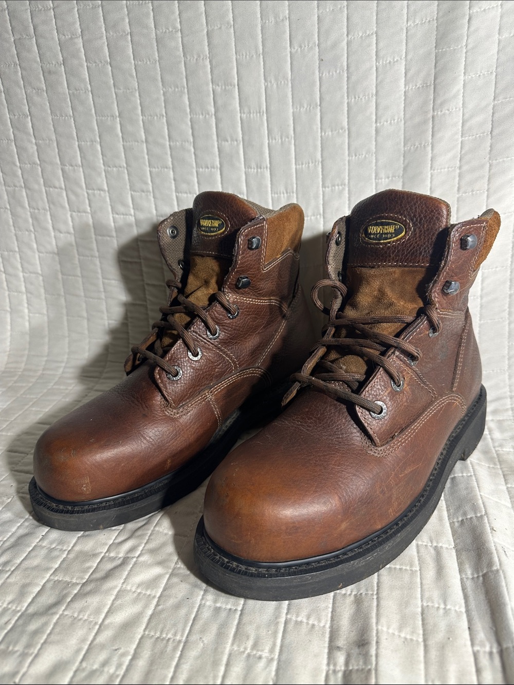 Wolverine Men's Tremor 6" Work Boots, featuring a dark brown leather upper